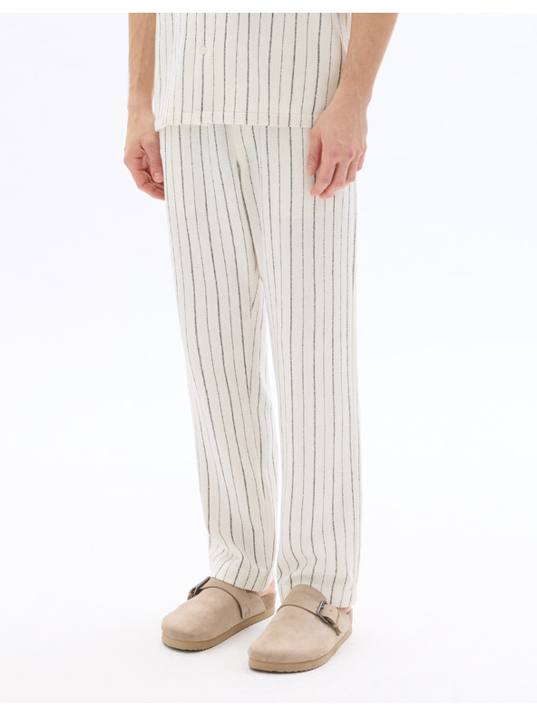 Celio 24H Nostripe nadrág