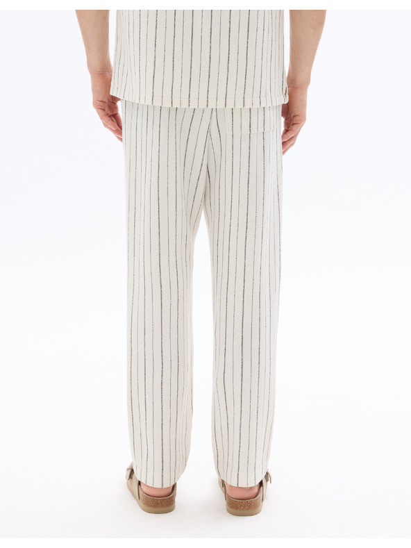 Celio 24H Nostripe nadrág